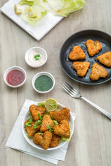 Heart shape cutlets with sauce and green chutney