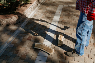 Man with ax gives ominous shadow