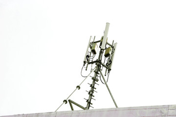 communication tower with antennas on the top of building isolate on white background