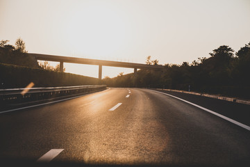 Fototapeta premium Sunset on straight country road