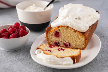 Cake with raspberries and whipped cream. Copy space.