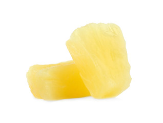 Pieces of delicious sweet canned pineapple on white background