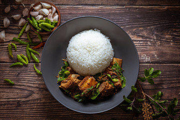Thai food, Rice topped with stir fried basil and pork bone.