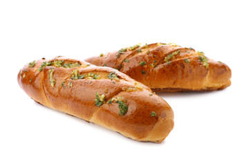 Bread loaves with garlic and herbs on white background