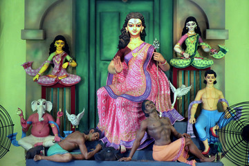 Obraz premium A close up view of a Durga idol. According to the Indian Mythology a decorated clay Sculptures of ten handed goddess Durga during the annual autumnal Durga Puja (worship) festival of India.