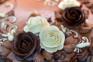 Fototapeta na wymiar Chocolate cake. Cream flowers. Birthday Treats.