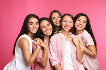 Happy women on pink background. Girl power concept