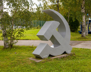 Metal monument hammer and sickle on the street