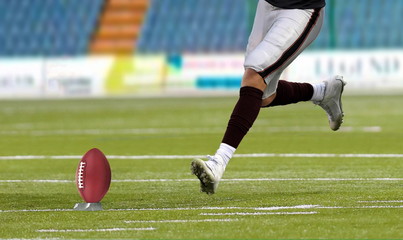 American football player kickoff on field - obrazy, fototapety, plakaty
