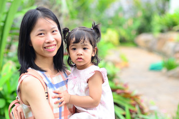 Little Child Girl and Mother at The Public Park