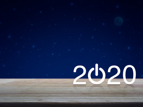 2020 start up business flat icon on wooden table over fantasy night sky and moon, Happy new year concept