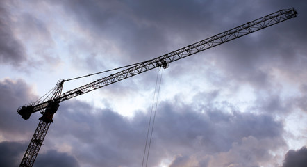 Tower crane on a background of thunderclouds