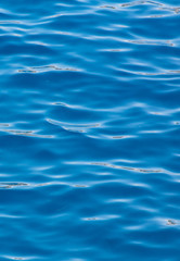 Blue expanse of water at sea as abstract background