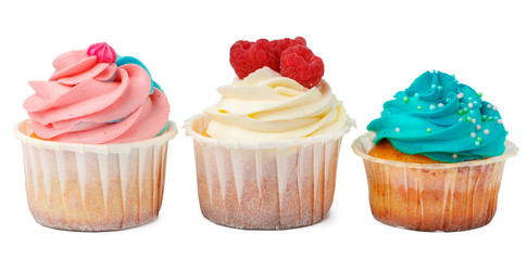 Three yummy cupcakes with icing  isolated on white background