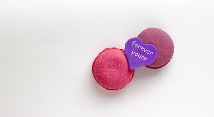 French Pink Macaroons on White Background. Top View Traditional Dessert for Feminine Design. Confectionery, Fashion, Beauty Advertising Template.