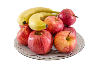red apples and bananas in a plate isolated on white background. Side view.