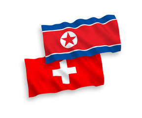 Flags of North Korea and Switzerland on a white background