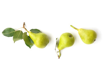 Green pears with leaves isolated on white background, top view