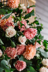 Gentle roses and gentle cloves decorate wedding arch. Beautiful wedding background