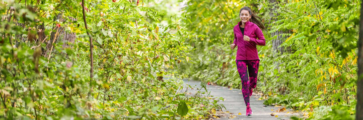 Happy healthy lifestyle active Asian girl jogging outdoors in green woods summer exercise banner...