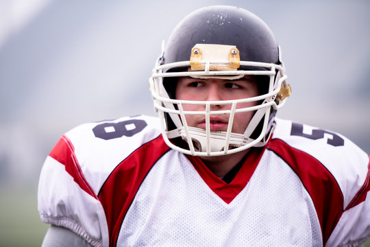 portrait of young confident American football player