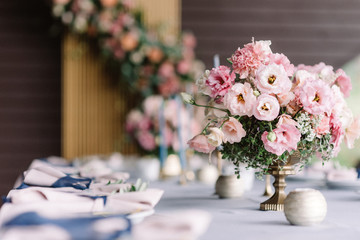 Decoration flowers of the festive table in the restaurant