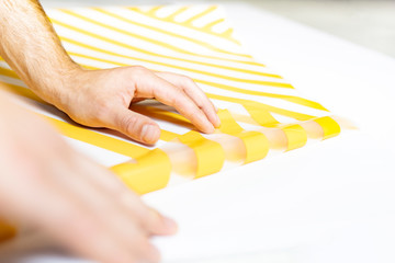 Advertising studio. Sticking with self-adhesive foil. Wrapping