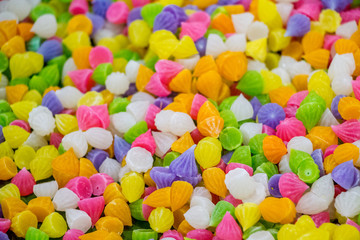 Fototapeta na wymiar Ar-lua, Aalaw or Alua candy, pile of Thai traditional colorful candy sweet dessert.