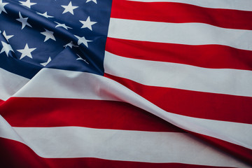 Flag of the United States of America closeup. Symbol of freedom and democracy. Independence day. American flag waving in the wind.
