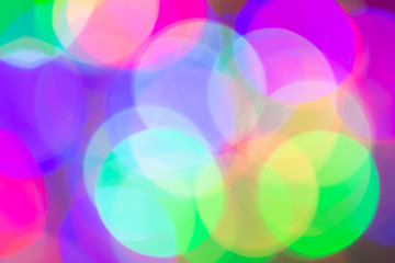 Blurred and defocused abstract multicolor background with christmas lights, soft multicolored bokeh circles