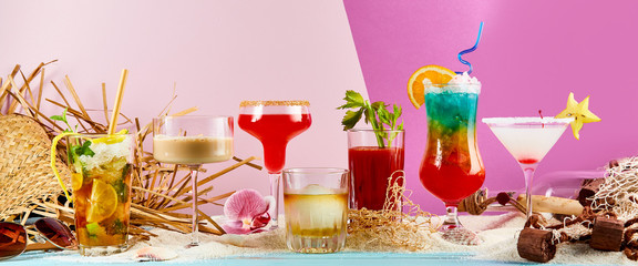 Large variety of exotic summer cocktails on sand