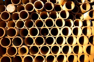 Round steel scaffold tubes stack on top of each other at laydown yard construction site, Sydney city Australia 