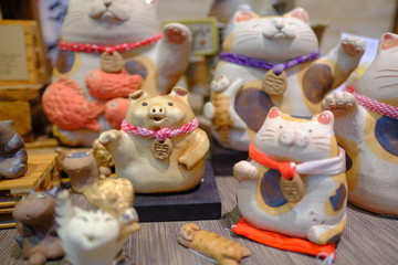 Cute Japanese style lucky cat ceramic decoration of holiday celebration