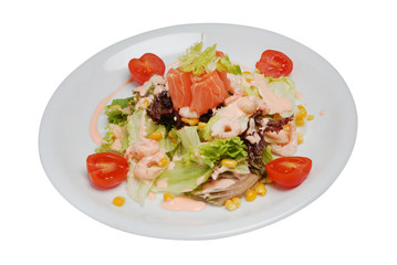 Vegetable seafood salad in plate on a white isolated background