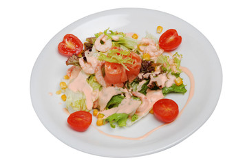 Vegetable seafood salad in plate on a white isolated background