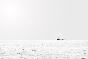 Minimal view Silence black and white sea small boat on Horizon Line.