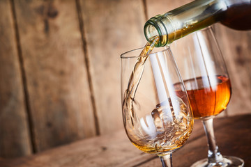 Dispensing golden sherry into a wineglass