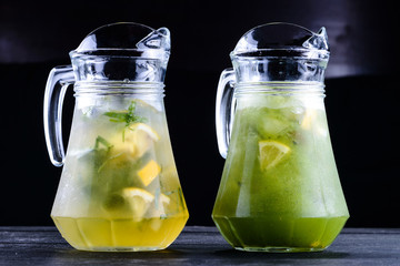 Collection of different drinks in glass jugs and jars. pitcher detox drink. Healthy eating