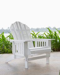 The white wood beach chair in the backyard