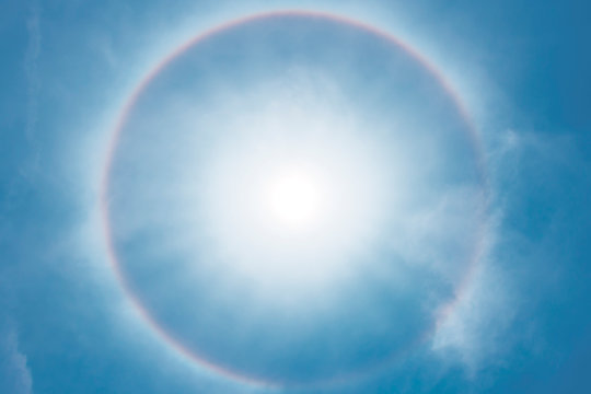 Sun halo phenomenon, circular rainbow around the sun.