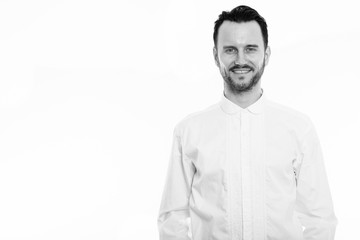 Studio shot of happy young man smiling