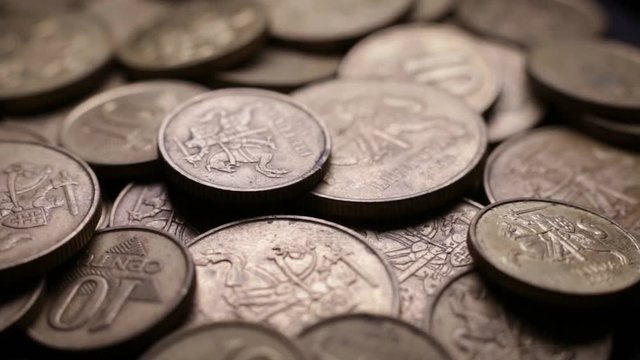 Close Up Of Lithuanian Centas Coins Rotating On Black Background. Loop Video