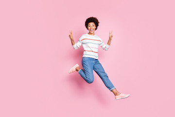 Fototapeta na wymiar Full length body size photo of cheerful cute funny girl showing you double v-sign while running towards goods discounted at shopping mall in jeans denim striped sweater isolated pastel color