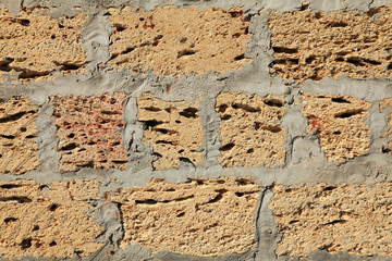The shell rock brick wall, texture. The fragment of a new bricklaying. The construction of a new...