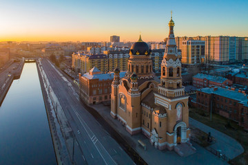 Fototapeta premium View of St. Petersburg with a drone. Dawn in St. Petersburg. Russia. Rivers Of St. Petersburg. Bypass channel. Church Of The Resurrection. Orthodox church. Religious buildings. Orthodoxy.
