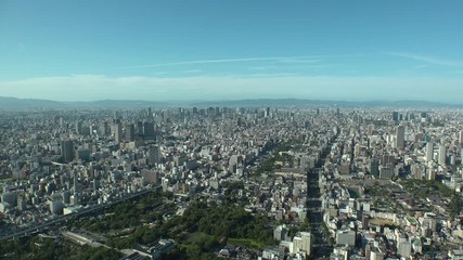 OSAKA, JAPAN - CIRCA SEPTEMBER 2019 : Aerial high angle view of CITYSCAPE of OSAKA in daytime. Osaka is the second largest metropolitan area in Japan. Zoom in shot.