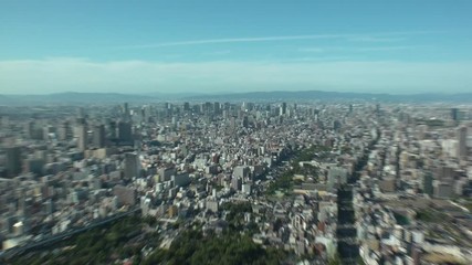 OSAKA, JAPAN - CIRCA SEPTEMBER 2019 : Aerial high angle view of CITYSCAPE of OSAKA in daytime. Osaka is the second largest metropolitan area in Japan. Zoom in shot.