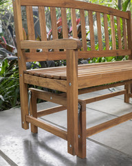Fototapeta na wymiar The detail of wood bench in the backyard.