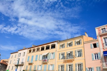 Fototapeta na wymiar House facade in the historic center of Saint Tropez, France, withmany blue sky