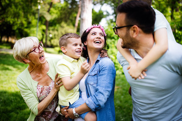 Multi generation family enjoying picnic in a park